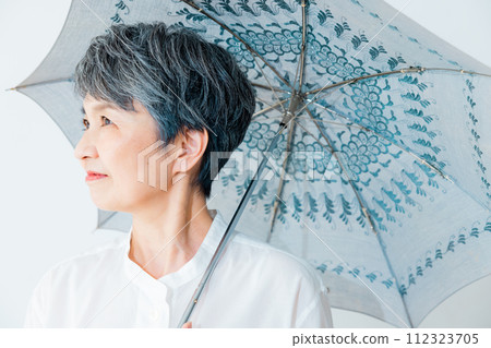 Senior woman sunblind Senior woman sunblind 112323705