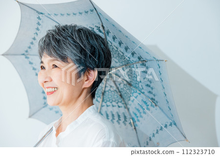 Senior woman sunblind 112323710