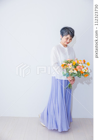 Senior women with flowers 112323730