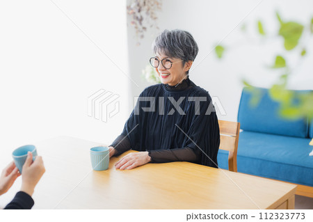 Senior woman having a conversation with a smile Senior woman having a conversation with a smile 112323773