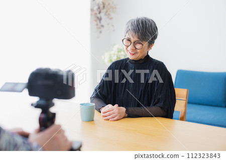 Senior woman being interviewed 112323843