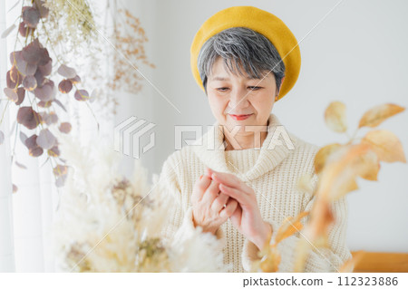 Senior women winter hand care 112323886