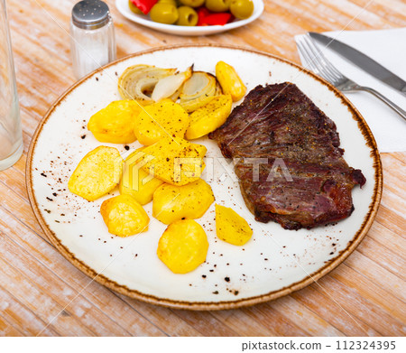 Appetizing beef entrecote with french fries Appetizing beef entrecote with french fries 112324395