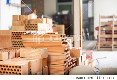 Stacks of bricks in apartment during repair works Stacks of bricks in apartment during repair works 112324445
