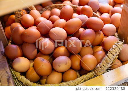 Basket of fresh eggs closeup 112324480