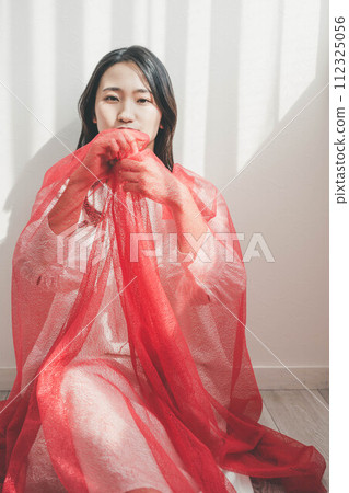 woman wearing red tulle 112325056