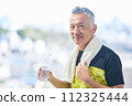 Senior man hydrating at the gym 112325444