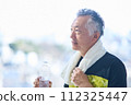 Senior man hydrating at the gym 112325447