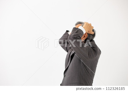Senior man holding his head in business Senior man holding his head in business 112326185