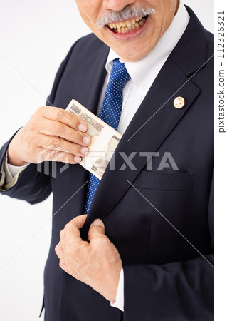 Senior male lawyer wad of bills close up Senior male lawyer wad of bills close up 112326321