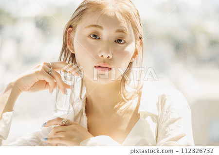 Portrait of a woman with cosmetics Portrait of a woman with cosmetics 112326732