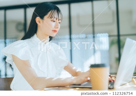 Young woman using a personal computer 112326754