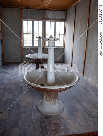Munich Germany Interior of living quarters, showing wash stands, at Dachau Concentration Camp, Munich, Germany Munich Germany Interior of living quarters, showing wash stands, at Dachau Concentration Camp, Munich, Germany 112326771