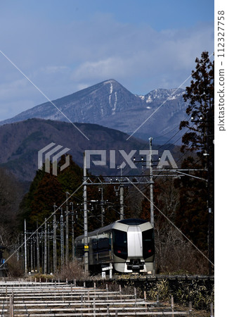 Liberty, the Tobu Limited Express running with Mt. Nikko Kecho in the background Liberty, the Tobu Limited Express running with Mt. Nikko Kecho in the background 112327758