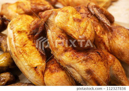 Bright Yellow Smoked Chicken closeup, macro photo 112327836