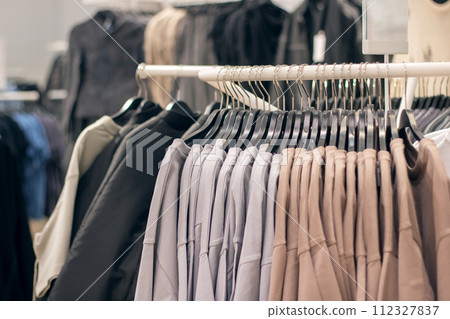 Jackets on hangers in a shop window Jackets on hangers in a shop window 112327837