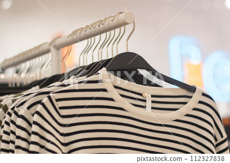 Jackets on hangers in a shop window Jackets on hangers in a shop window 112327838