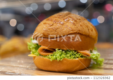 Closeup view of the polo chicken salami bun. 112328362