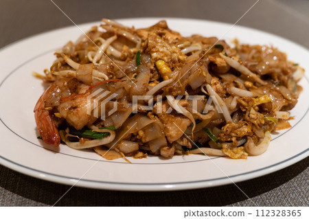 Fried Char Kway Teow is a stir-fried rice noodle dish popular food in Malaysia and Singapore. 112328365