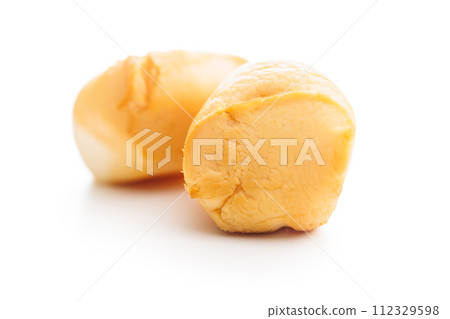 Smoked mini scamorza cheese. Traditional italian cheese isolated on white background. Smoked mini scamorza cheese. Traditional italian cheese isolated on white background. 112329598