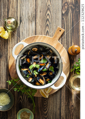 Mussels in a pot culinary concept, top down view Mussels in a pot culinary concept, top down view 112329625