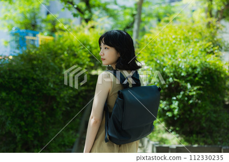 A woman walking in the park 112330235