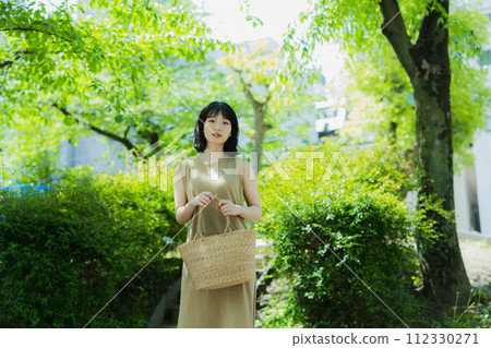 A woman walking in the park 112330271