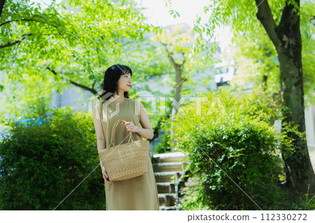 A woman walking in the park 112330272