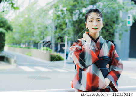 A woman in a kimono Meisen with a geometric pattern A woman in a kimono Meisen with a geometric pattern 112330317