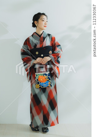A woman in a kimono Meisen with a geometric pattern A woman in a kimono Meisen with a geometric pattern 112330367