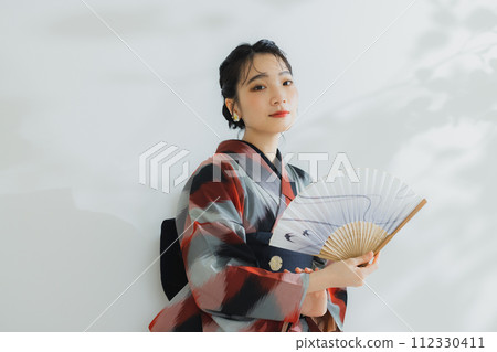 A woman in a kimono Meisen with a geometric pattern A woman in a kimono Meisen with a geometric pattern 112330411
