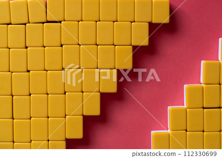 Blocks lined up on a red background 112330699