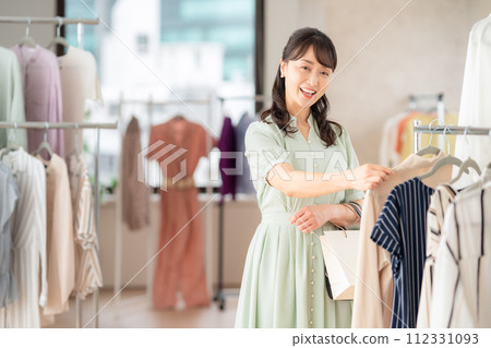 Middle-aged woman shopping at a store 112331093