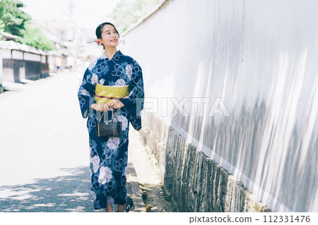 A woman in a yukata A woman in a yukata 112331476