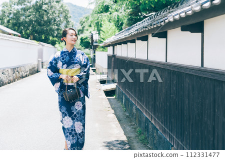 A woman in a yukata A woman in a yukata 112331477