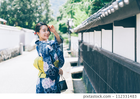 A woman in a yukata A woman in a yukata 112331483