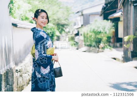 A woman in a yukata A woman in a yukata 112331506