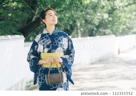 A woman in a yukata A woman in a yukata 112331552