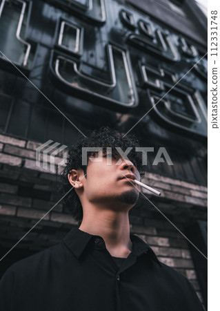 man smoking outdoors man smoking outdoors 112331748