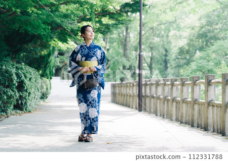 A woman in a yukata A woman in a yukata 112331788