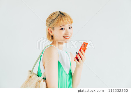 A young lady with a smartphone 112332260