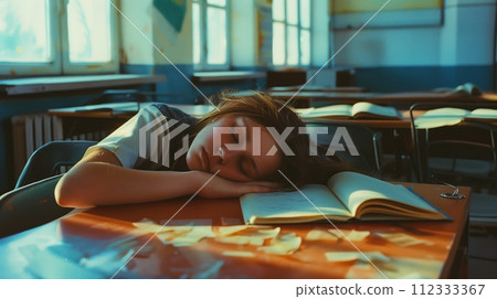 A student is sleeping in the classroom. A student is sleeping in the classroom. 112333367