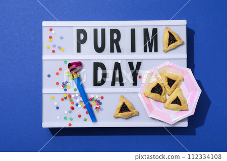 Purim holiday concept, with traditional symbols and decor. 112334108