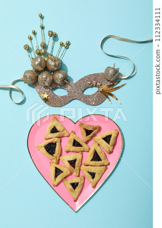 A mask with traditional cookies for the day of Purim. A mask with traditional cookies for the day of Purim. 112334111