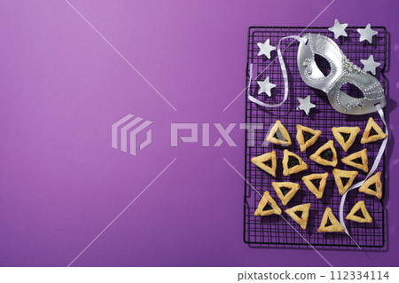 A mask with traditional cookies for the day of Purim. 112334114