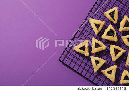 Purim holiday concept, with traditional symbols and decor. 112334116