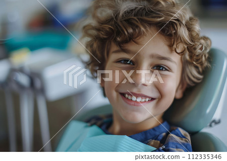 Photo of smiling boy in dental chair, visit to the dentist 112335346