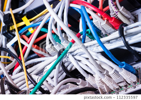 various ethernet cables plugged in network switch various ethernet cables plugged in network switch 112335597
