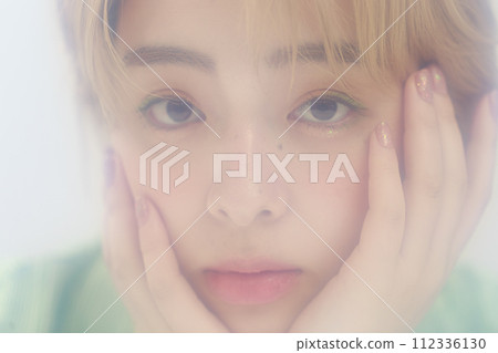 Young woman with nuanced makeup Young woman with nuanced makeup 112336130