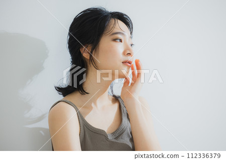 Women in tank tops body care 112336379